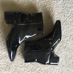 Glossy patent leather booties